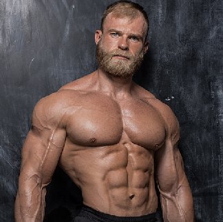 buff male stripper with a beard